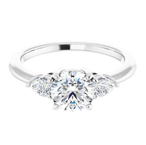 three-stone engagement ring with pear-shaped side stones and polished band