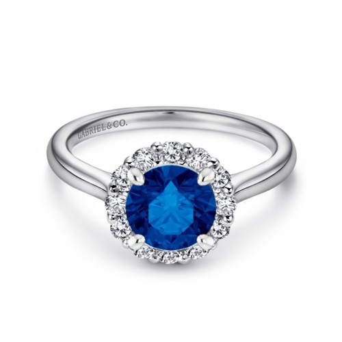 14K white gold halo engagement ring with round blue sapphire center stone and natural diamond accents in the halo