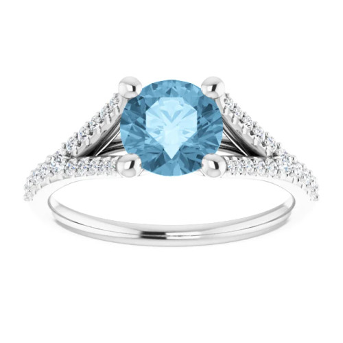 14K gold spit shank engagement ring with round blue topaz center stone and lab grown diamond accented band