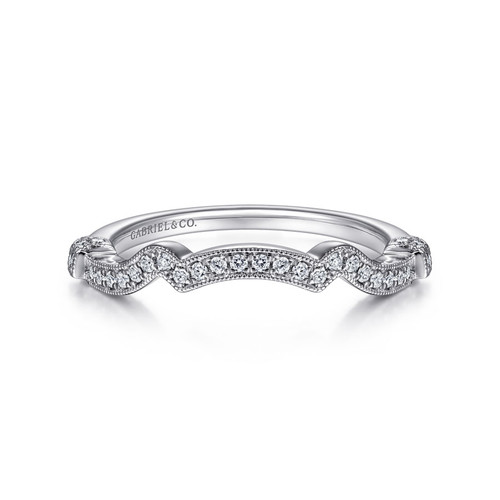 vintage-inspired wedding ring with channel set diamonds and ornate details