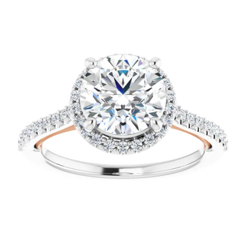 halo engagement ring with round moissanite center stone and natural diamond accents on the halo and band with a twisted strip of metal forming a heart beneath the center stone