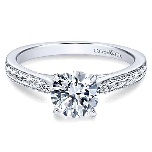 14K white gold solitaire engagement ring with round natural diamond center stone and milgrain detailed band