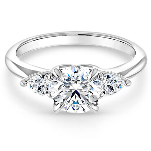 three-stone engagement ring with polished band and pear-shaped diamond accent stones