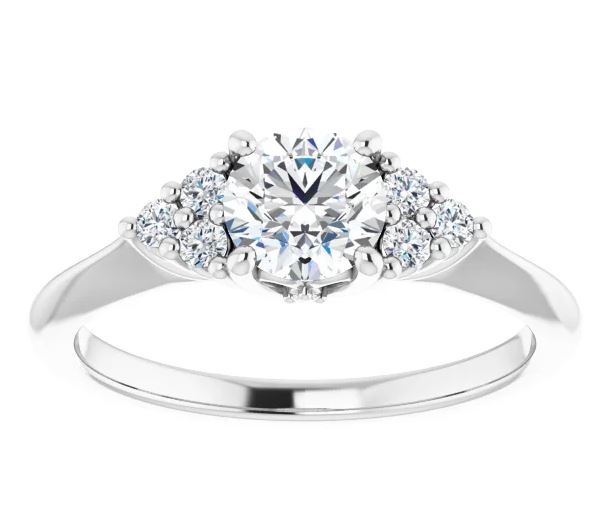 engagement ring setting with clusters of accent diamonds that sit on either side of the center stone with a polished band