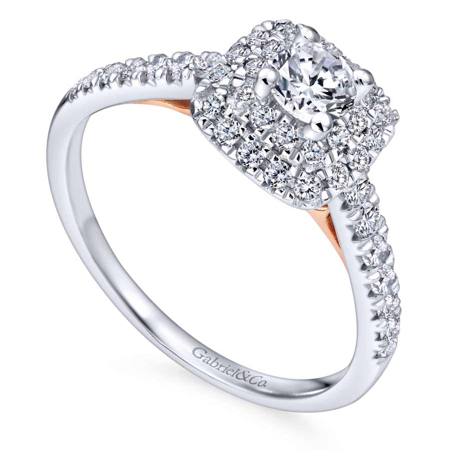 14K white gold halo engagement ring with round lab grown diamond center stone and natural diamond accents in the halo and band with 14K rose gold detailing beneath the center stone