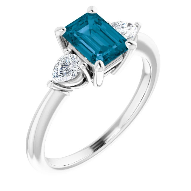14K gold three stone engagement ring with emerald-cut london blue  topaz center stone and pear-shaped lab grown diamond side stones with a polished band