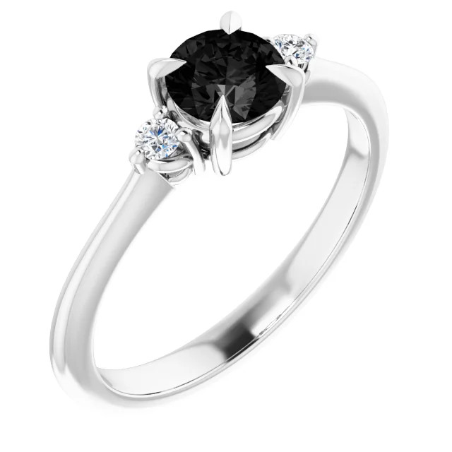 three-stone engagement ring with black diamond center stone and natural diamond accent stones with a polished band