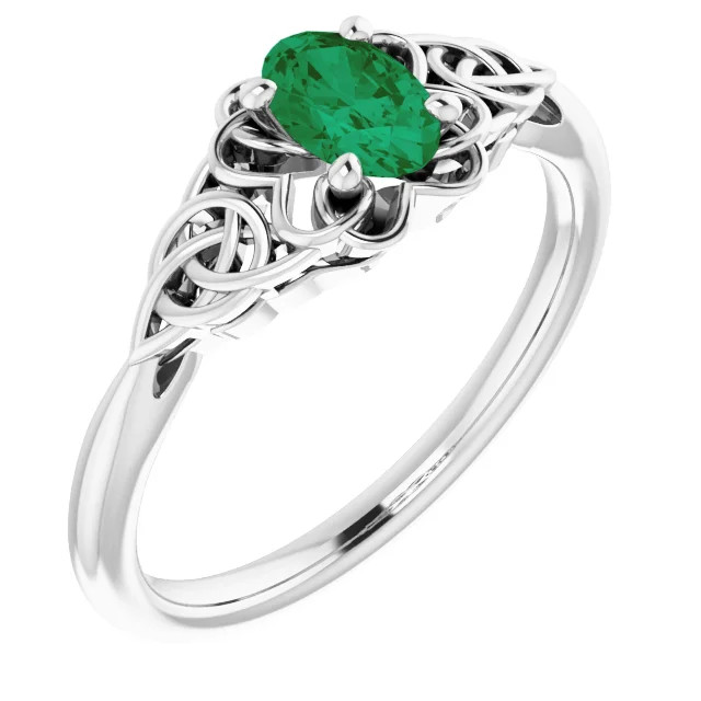 14K gold promise ring with oval-shaped emerald and celtic-knot band