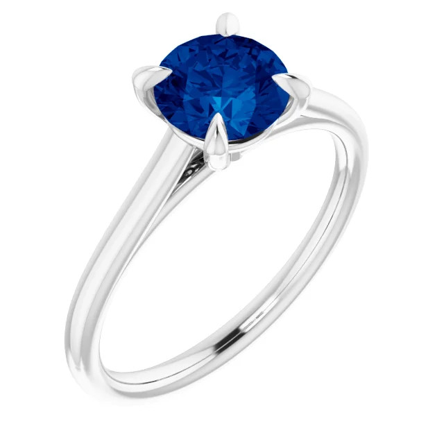 14K gold solitaire engagement ring with round sapphire center stone and polished band