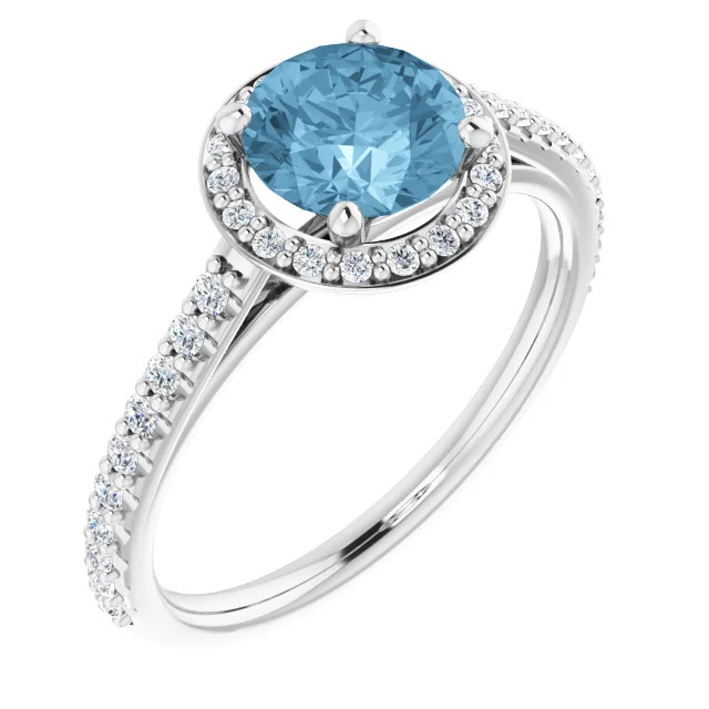 14K gold halo engagement ring with round blue topaz center stone and lab grown diamond halo and accented band