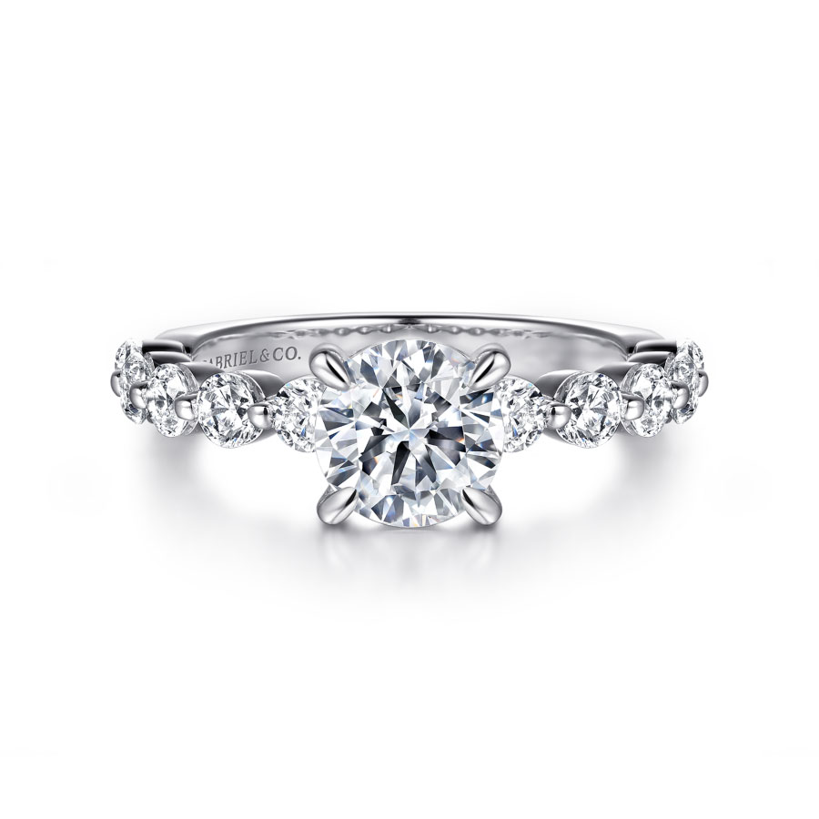 straight engagement ring with round moissanite center stone and polished band with semi-bezel set natural diamond accent stones