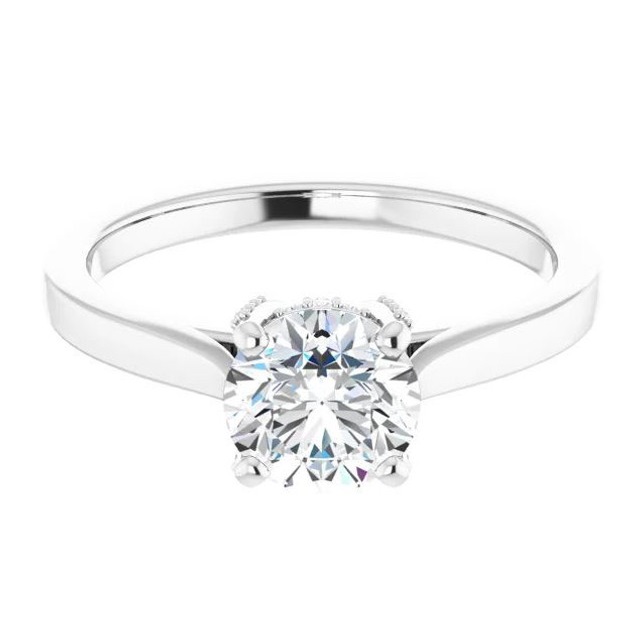 solitaire engagement ring with hidden halo of accent stones and polished band