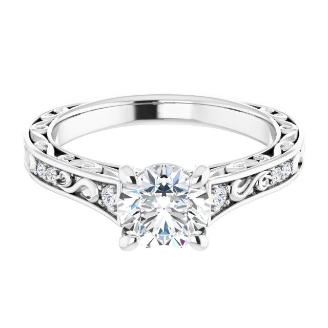 vintage-inspired engagement ring with scrollwork and diamond accents in the band