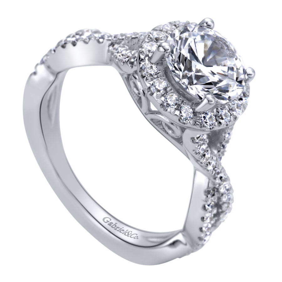 halo engagement ring with round moissanite center stone and criss-cross band with pave diamonds