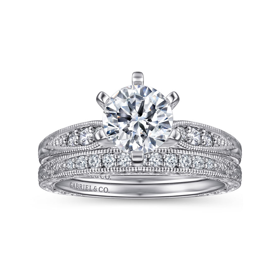 vintage-inspired wedding ring with channel set diamonds and milgrain detailing