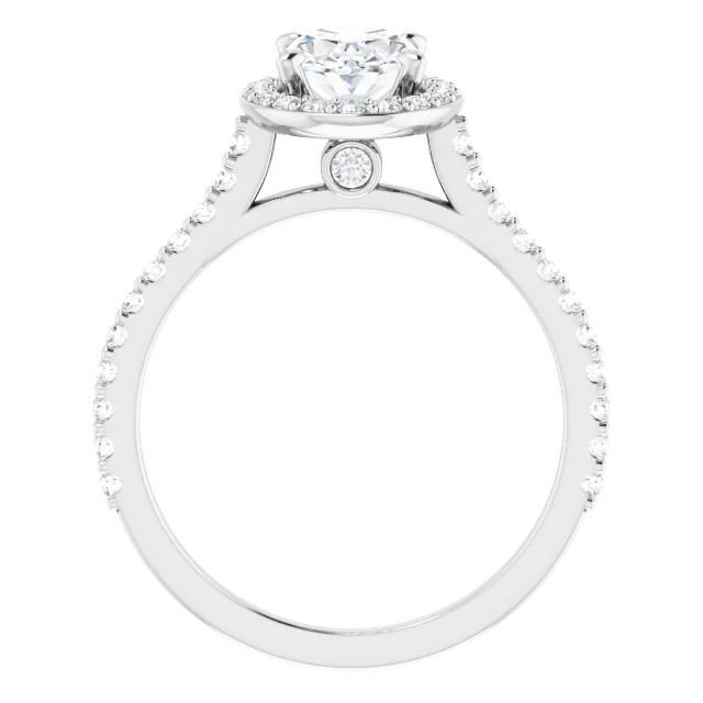halo engagement ring with oval shaped moissanite center stone and natural diamond accents on the halo and the band