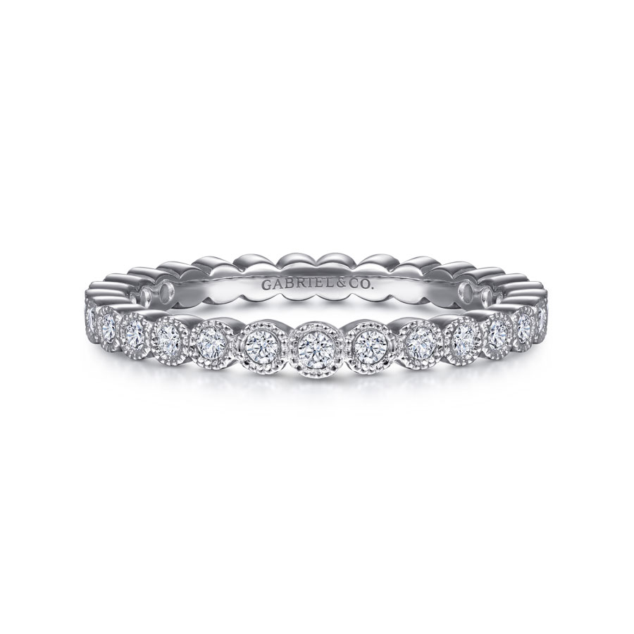 14K white gold bezel set diamond eternity ring with milgrain detailing