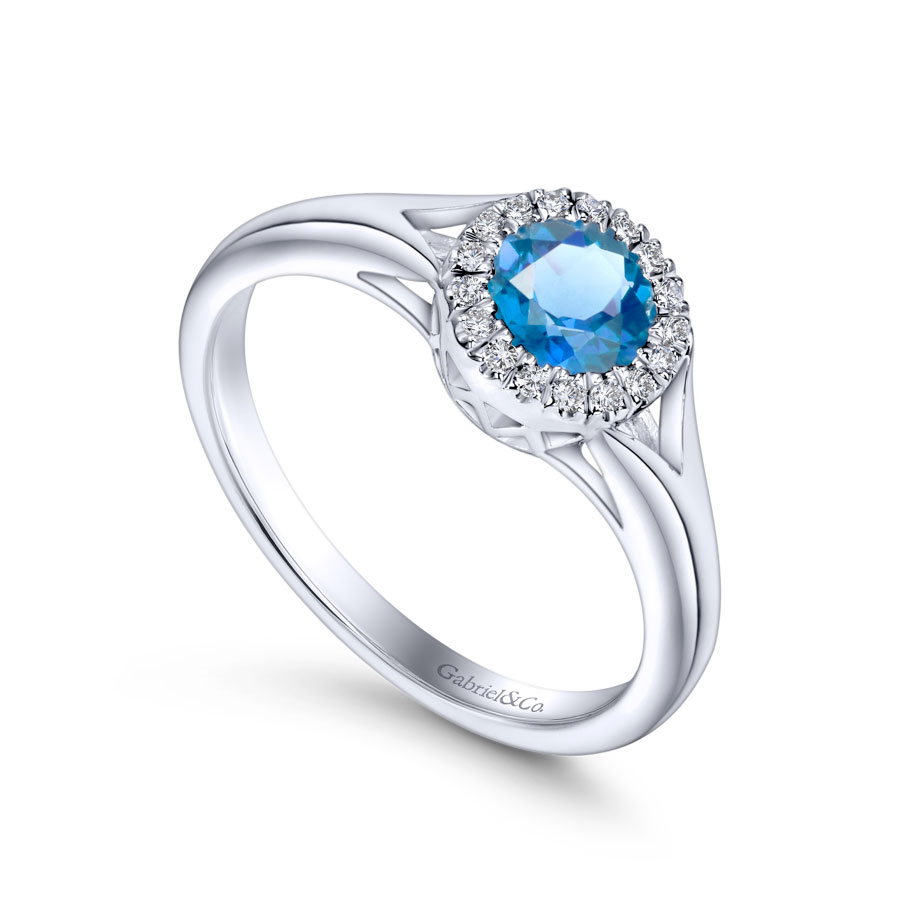 14K white gold split shank ring with blue topaz and diamond halo