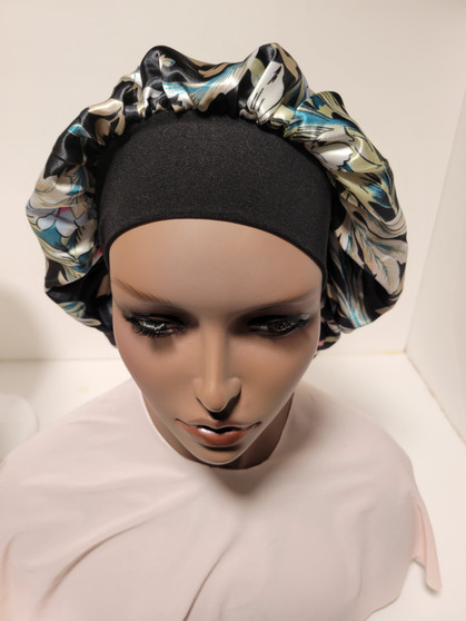 Floral design with a  combination of  black, ivory, light mint