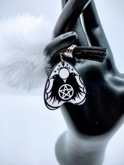 The Ouija Board crow Style Keychain is a cool and spooky way to express your inner Spirit.