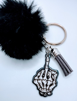 Simple Statement Acrylic Keychain With Fur And Tassel. Acrylic Keychain is made with 100% premium acrylic and features a Bone middle finger. This keychain makes the perfect gift for all defiant individuals. Our designers carefully choose every material to bring you the best quality and craftsmanship possible. Though the color of the fur may vary upon delivery due to availability, each keychain features an original unique design.