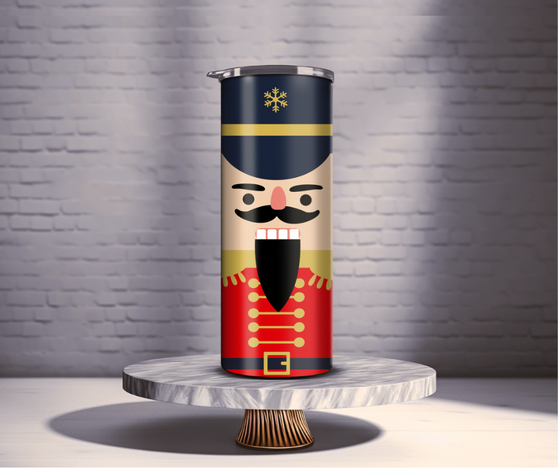 Skinny Stainless Steel Tumbler, featuring a delightful traditional holiday nutcracker design! Crafted with premium quality stainless steel, this tumbler is the perfect companion for your daily adventures or cozy evenings at home.
