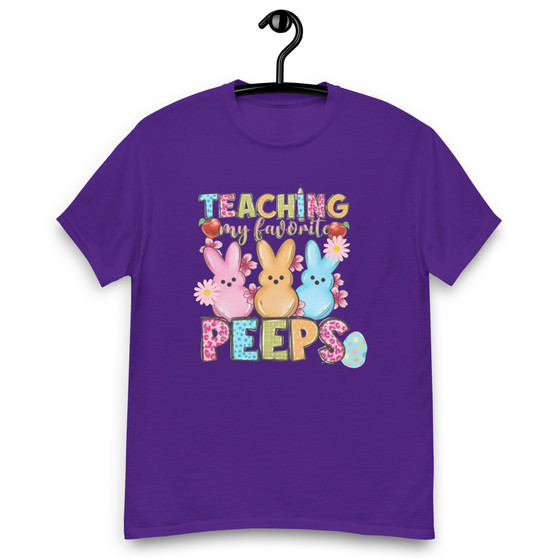 This Easter, show your love for your students and celebrate the season in style with the "Teaching My Favorite Peeps" Unisex Classic Tee. A perfect blend of comfort, style, and festive spirit, this tee is a must-have for any educator's wardrobe.