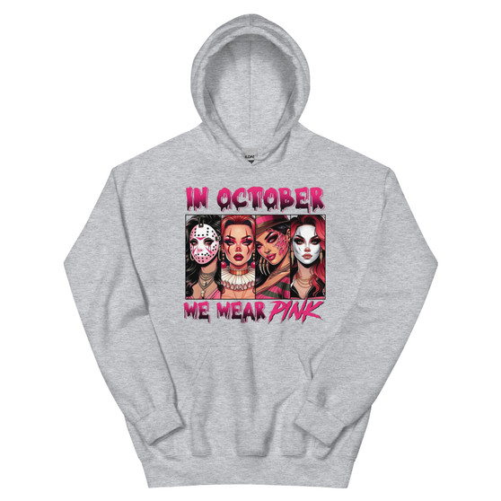 Hoodie featuring Halloween character headshots and the phrase “In October We Wear Pink” in playful pink lettering. Soft, midweight, and cozy with a front pouch pocket and double-lined hood.