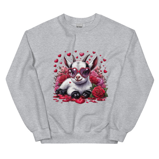 Crew neck sweatshirt shown flat featuring a cute goat wearing heart-shaped sunglasses, surrounded by Valentine hearts and floral accents. Design uses soft pastel tones and has no wording.