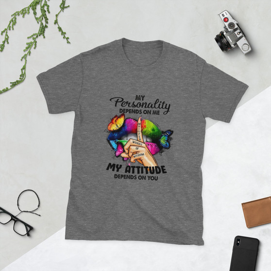 “My Personality Depends On Me My Attitude Depends On You graphic t-shirt featuring colorful neon lips with butterflies and finger whisper design, full view showing vibrant rainbow artwork on light heather gray shirt, perfect for bold inspirational statement wear.”