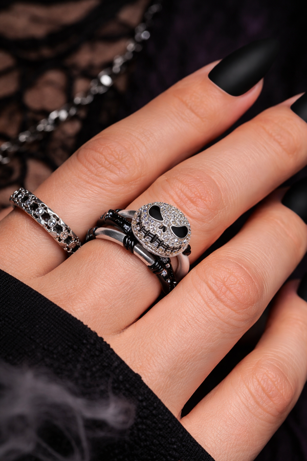 Includes clean product shots on a white background, lifestyle images worn on hand, display stand views, and moody flat lays highlighting the rhinestone detail and stacked design.