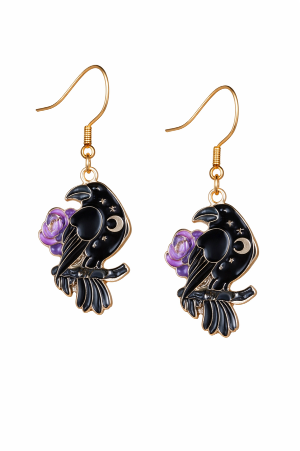 A curated set of Mystic Charm earrings featuring intricate, gothic-inspired designs with enamel detailing and gold-tone hooks. Styled across a mix of clean product shots and moody, aesthetic backgrounds, this collection blends dark elegance with a mystical edge. Each piece showcases unique character and craftsmanship, perfect for adding a bold, alternative statement to any look.