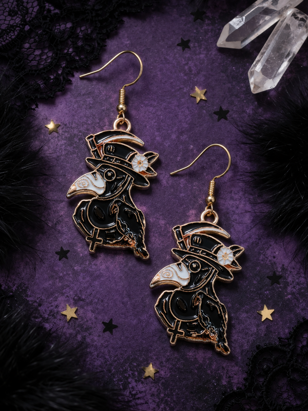 A curated set of Mystic Charm earrings featuring intricate, gothic-inspired designs with enamel detailing and gold-tone hooks. Styled across a mix of clean product shots and moody, aesthetic backgrounds, this collection blends dark elegance with a mystical edge. Each piece showcases unique character and craftsmanship, perfect for adding a bold, alternative statement to any look.