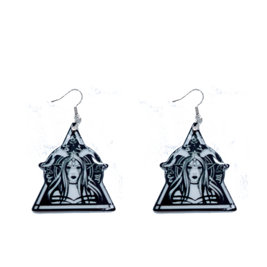 A curated collection of witchy-inspired acrylic earrings featuring dark, mystical designs including celestial symbols, occult figures, crystal shapes, and gothic motifs. Each pair showcases bold black detailing paired with soft lavender accents, displayed in styled scenes with crystals, candles, and moody textures. The collection blends alternative fashion with mystical aesthetics, creating a cohesive, edgy yet feminine visual