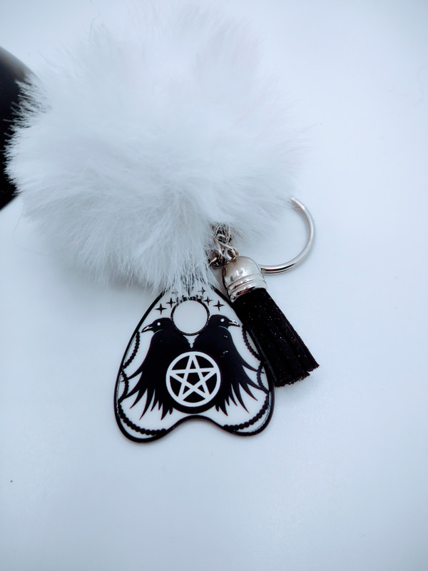 The crow Style Keychain is a cool and spooky way to express your inner Spirit.