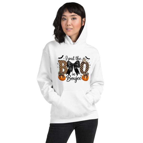 Hoodie featuring a cute Halloween design with a bow and pumpkins, and the phrase “I Put the Boo in Boujee.” Playful and girly Halloween style.