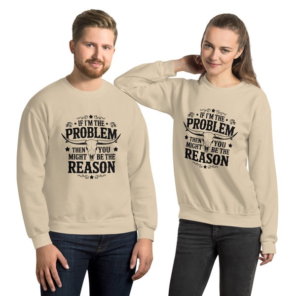 “If I’m the Problem You Might Be the Reason tan crew neck sweatshirt featuring bold sarcastic quote design, full view showing neutral color and statement graphic, perfect for humor lovers and edgy casual wear.”
