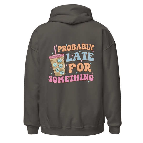Back of a charcoal gray pullover hoodie featuring a large pastel graphic with an iced coffee cup and retro lettering that reads “Probably Late For Something.” The design is centered across the upper back.