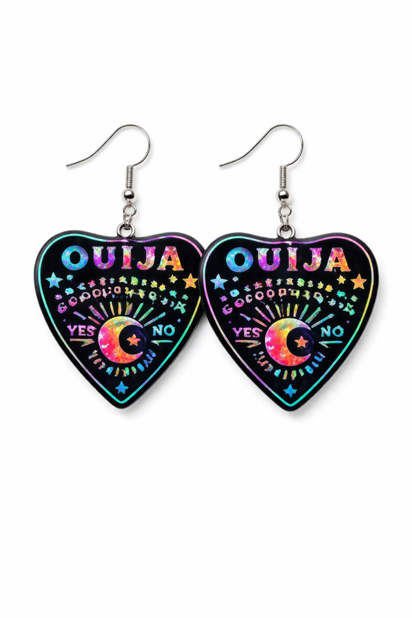 Collection of Ouija planchette acrylic earrings displayed in multiple design variations on a clean background. Each pair features unique lettering styles, symbols, and finishes while maintaining a cohesive dark, witchy aesthetic. The assortment highlights different options within the same occult-inspired theme.
