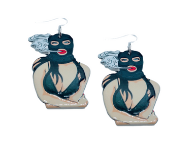 An assortment of edgy acrylic earrings featuring bold, rebellious designs including skeleton hands, sarcastic symbols, and attitude-driven graphics. Each pair showcases high-contrast detailing and expressive themes, styled against clean or minimal backgrounds to highlight their statement-making appeal.