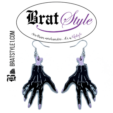 High-quality product images showcasing a pair of bold, gothic-inspired acrylic dangle earrings with a dark, edgy design, captured to highlight detail, size, and overall aesthetic against clean or styled backgrounds.