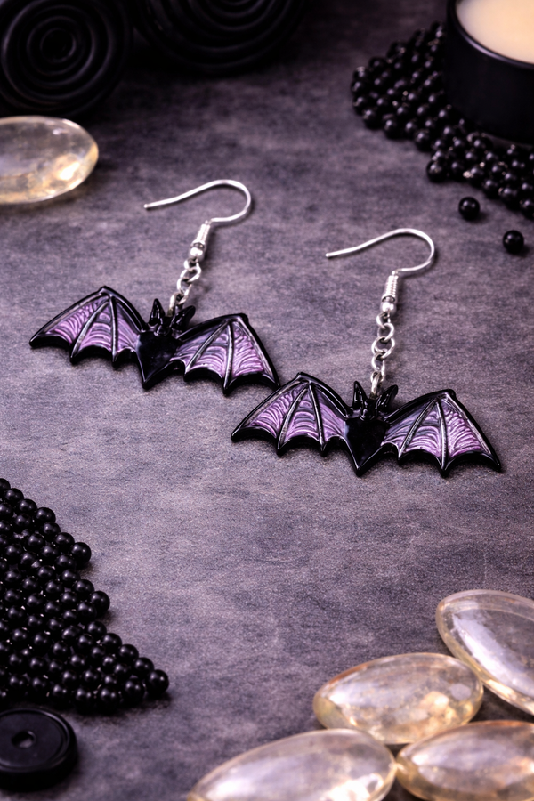 High-quality product images showcasing a pair of bold, gothic-inspired acrylic dangle earrings with a dark, edgy design, captured to highlight detail, size, and overall aesthetic against clean or styled backgrounds.