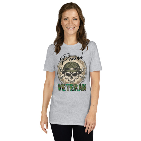 Photos showcase a Stone Gray patriotic graphic t-shirt featuring a distressed military-inspired skull artwork with tactical helmet details, camouflage typography, rugged Americana styling, and bold veteran-themed graphics. Product images highlight high-resolution DTF printing, edgy patriotic aesthetics, vintage military-inspired textures, and oversized front graphic placement designed for comfortable everyday wear.