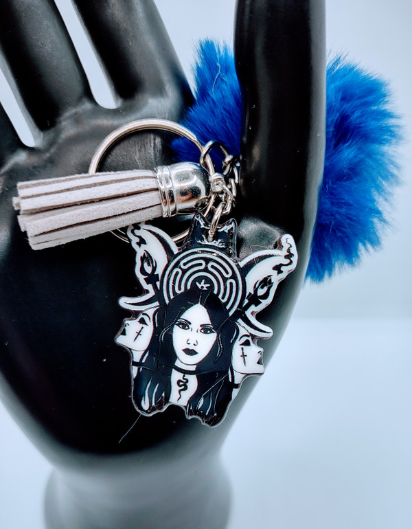 The Trio Acrylic Keychain with Fur and Tassel Charm