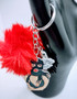 The Lady Bandit Acrylic Keychain depicts a seductive lady in a ski mask. Like a sexy bandit. The fur and tassel add an extra bit of detail. This unique keychain makes the perfect gift for anyone! Acrylic Keychain is made with 100% premium acrylic. Our designers carefully choose every material to bring you the best quality and craftsmanship possible. Though the color of the fur may vary upon delivery due to availability, each keychain features an original unique design.