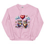 Crew neck sweatshirt shown flat featuring two pastel-colored owls sitting on a branch with a heart-shaped balloon between them. Design uses soft Valentine pastel tones with a cute, cozy aesthetic.