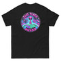Unisex t-shirt displayed flat showing a bright alien graphic printed small on the front pocket and large on the back. Neon-style, colorful design with bold “This Place Sucks” lettering.
