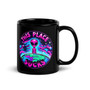 Black gloss ceramic mug displayed upright featuring a bright alien graphic with the phrase “This Place Sucks.” Bold neon colors pop against the black background. Shown with front-facing design for clear visibility.