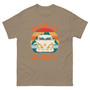 “Stay Trippy Lil Hippy unisex t-shirt featuring vintage van graphic and playful text on tan shirt, full view showing retro colors and boho hippie design, perfect for festival wear and free-spirit style.”
