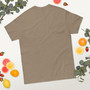 “Stay Trippy Lil Hippy unisex t-shirt featuring vintage van graphic and playful text on tan shirt, full view showing retro colors and boho hippie design, perfect for festival wear and free-spirit style.”